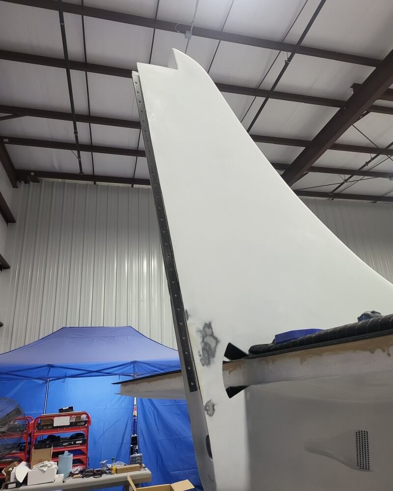 Composite hinge on an aircraft tail control surface